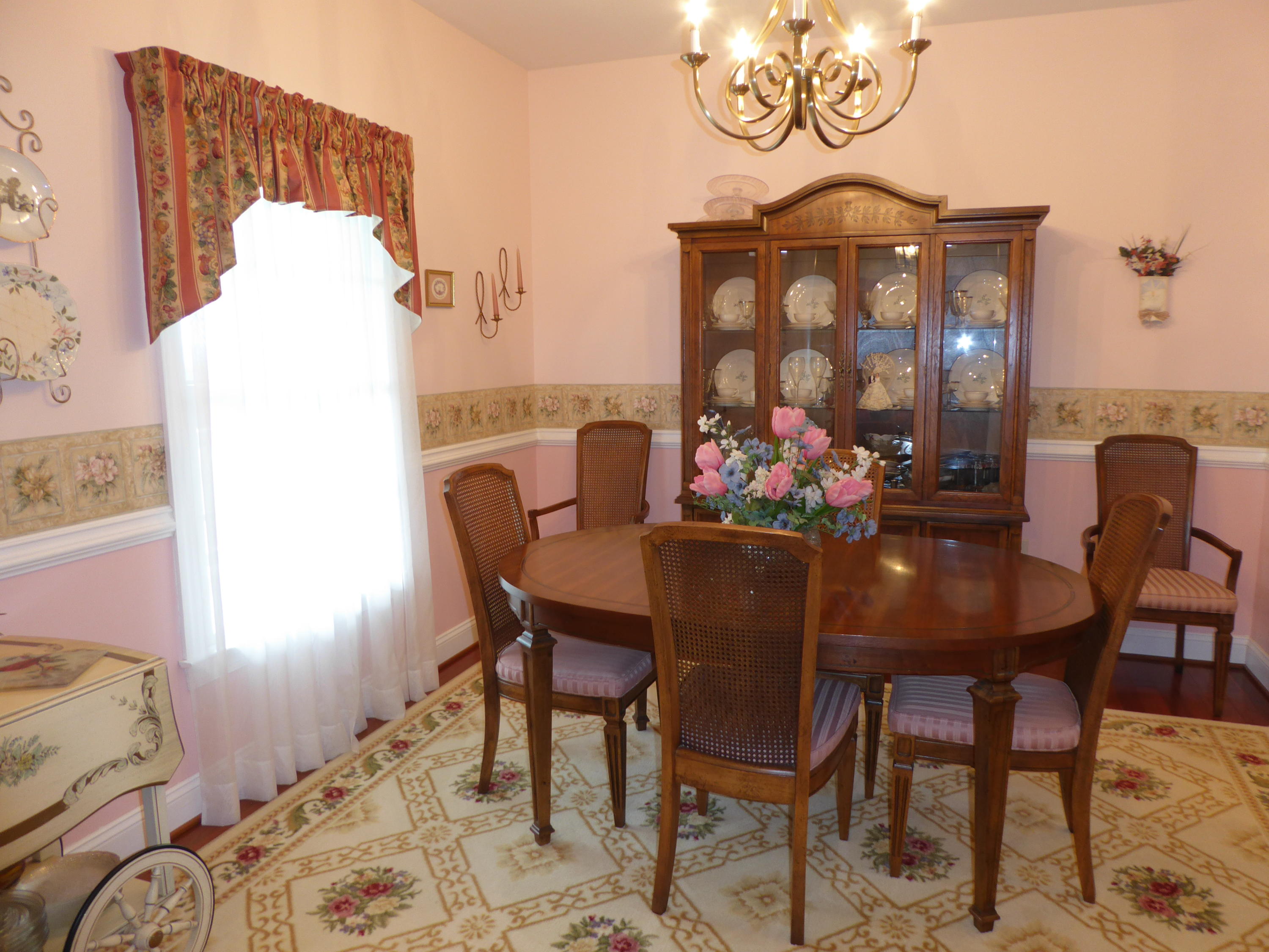 12419 Callaway Road Callaway, VA 24067 - Photo 31 of 96 a view of a dining room with furniture and a chandelier