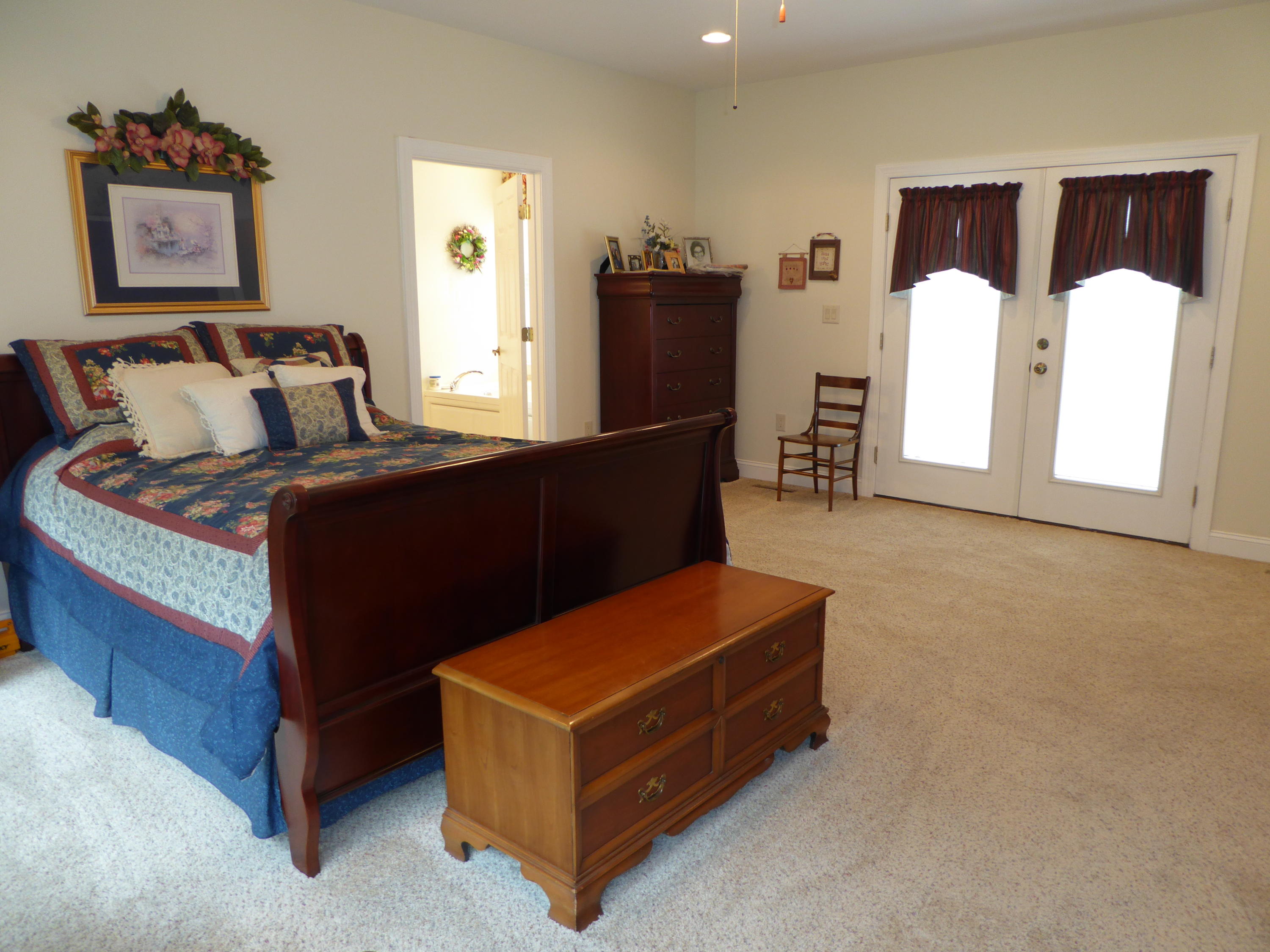 12419 Callaway Road Callaway, VA 24067 - Photo 32 of 96 a bed room with a bed and a painting