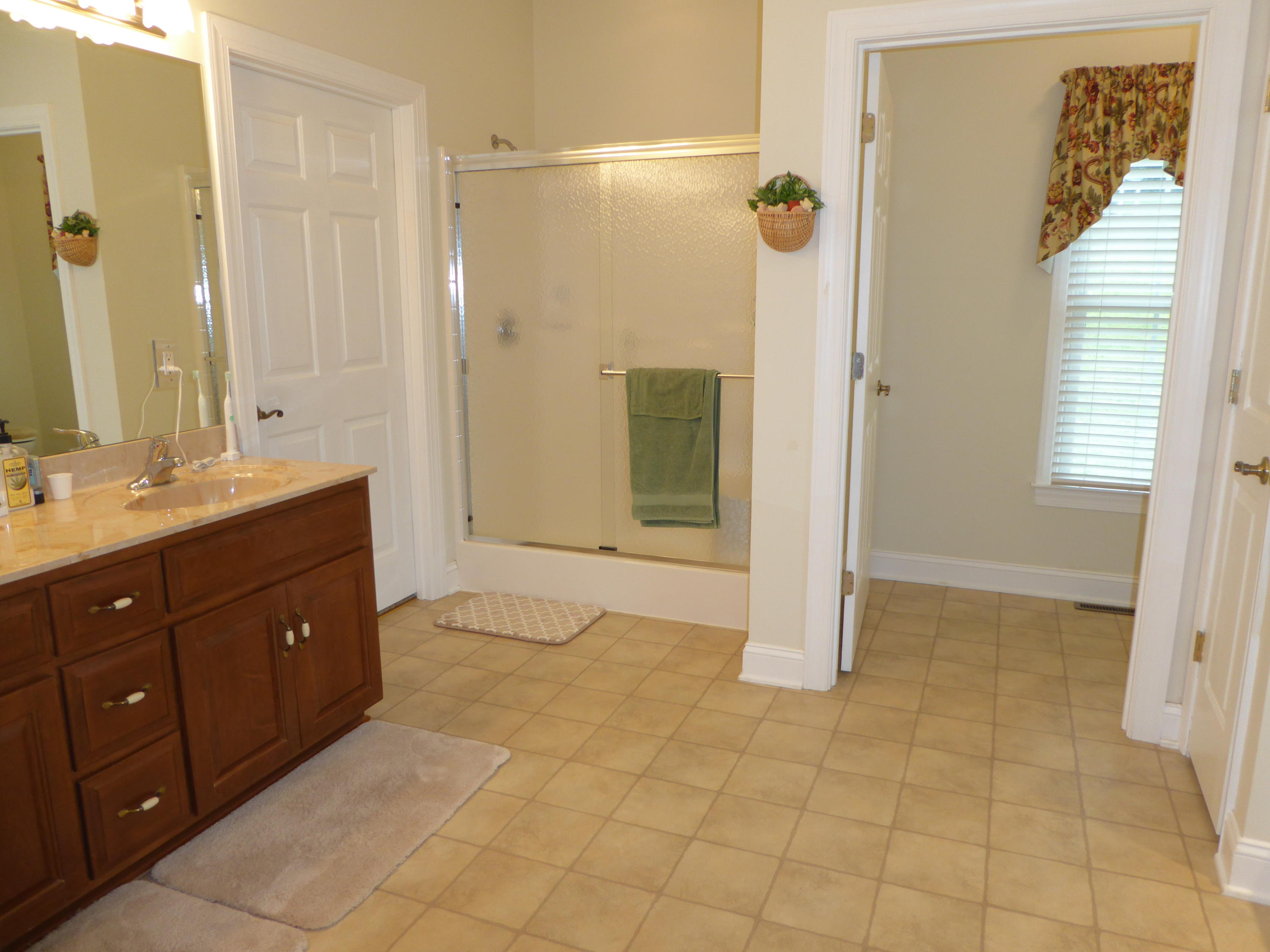 12419 Callaway Road Callaway, VA 24067 - Photo 35 of 96 a bathroom with a sink a mirror and a shower
