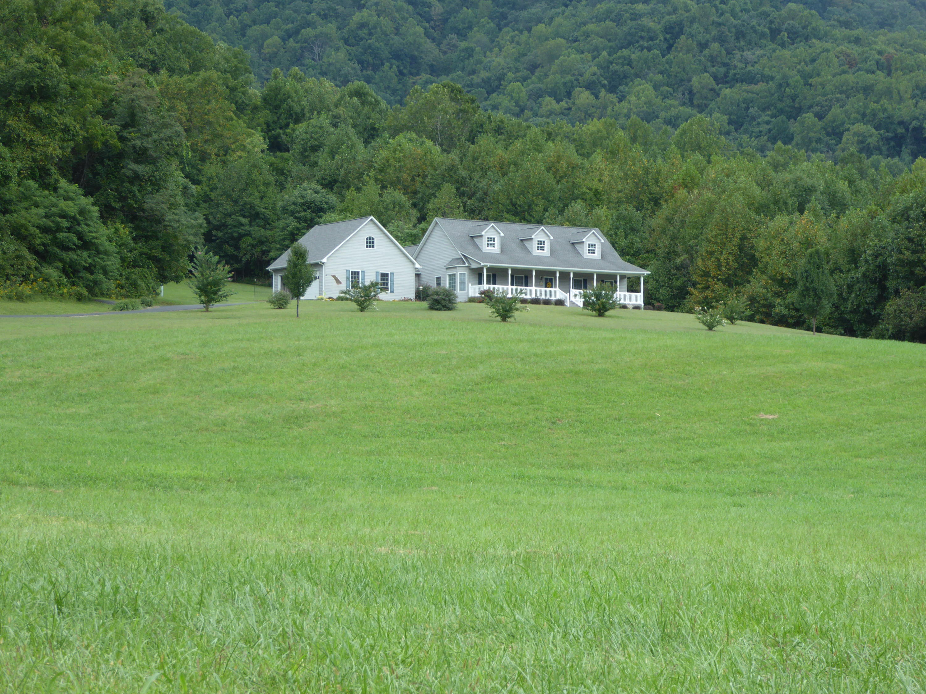 12419 Callaway Road Callaway, VA 24067 - Photo 66 of 96 a view of a big house with a big yard and large trees