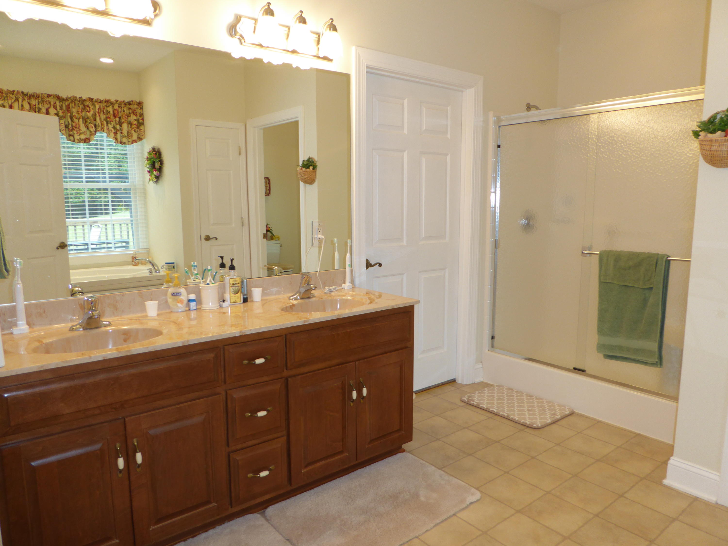 12419 Callaway Road Callaway, VA 24067 - Photo 8 of 96 a bathroom with a double vanity sink mirror and shower