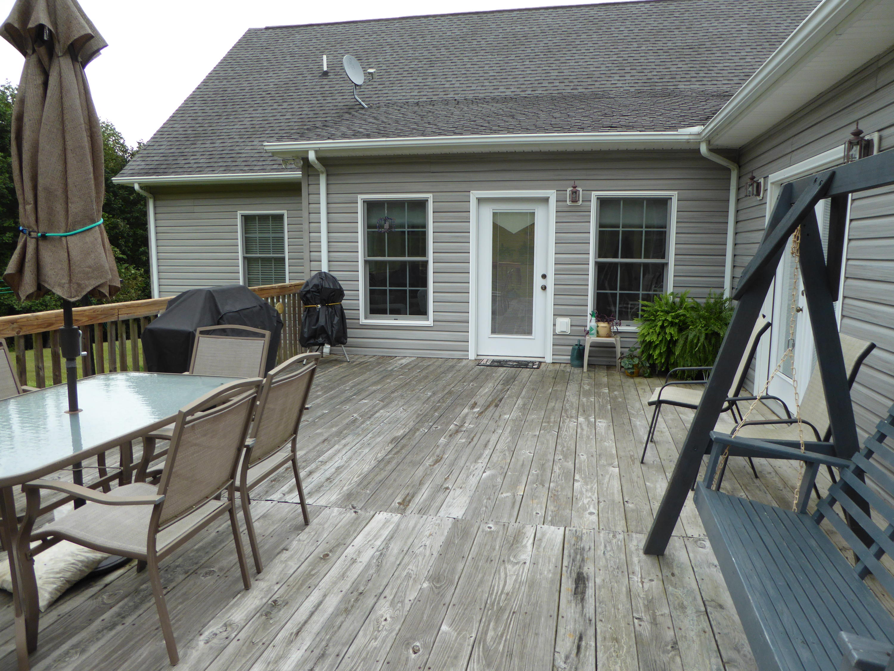 12419 Callaway Road Callaway, VA 24067 - Photo 91 of 96 a balcony with wooden floor and outdoor seating