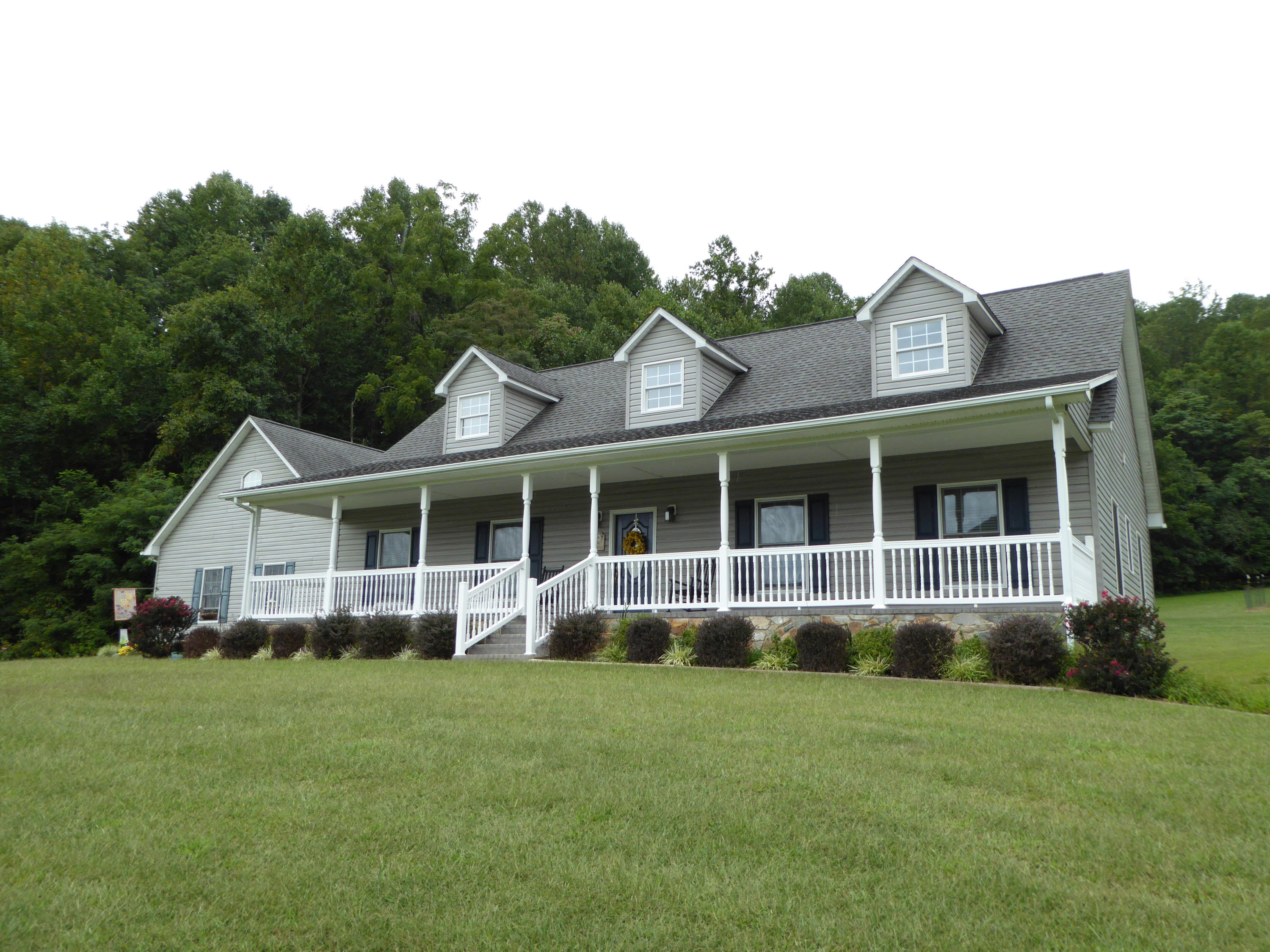 12419 Callaway Road Callaway, VA 24067 - Photo 96 of 96 a view of a house with a yard and potted plants