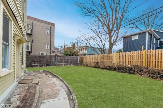 a view of a backyard of the house