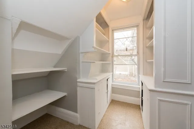 a view of an empty walk in closet