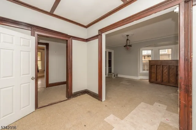 a view of a hallway with wooden shelves