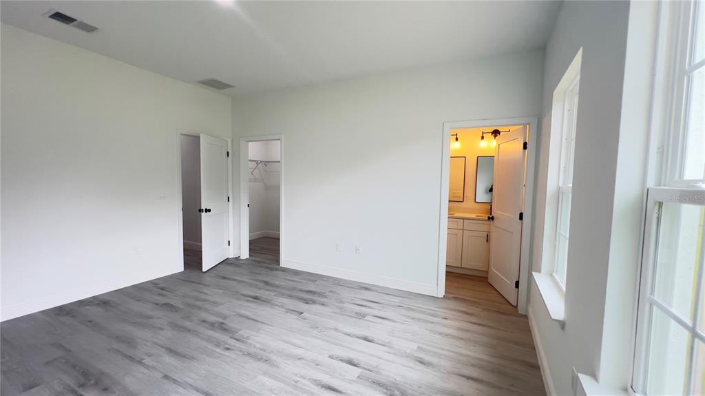 16734 Southwest 18th Avenue Road Ocala, FL 34473 - Photo 15 of 36 a view of a hallway with a wooden floor