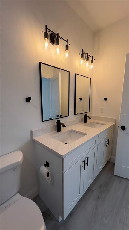16734 Southwest 18th Avenue Road Ocala, FL 34473 - Photo 17 of 36 a bathroom with a double vanity sink and mirror