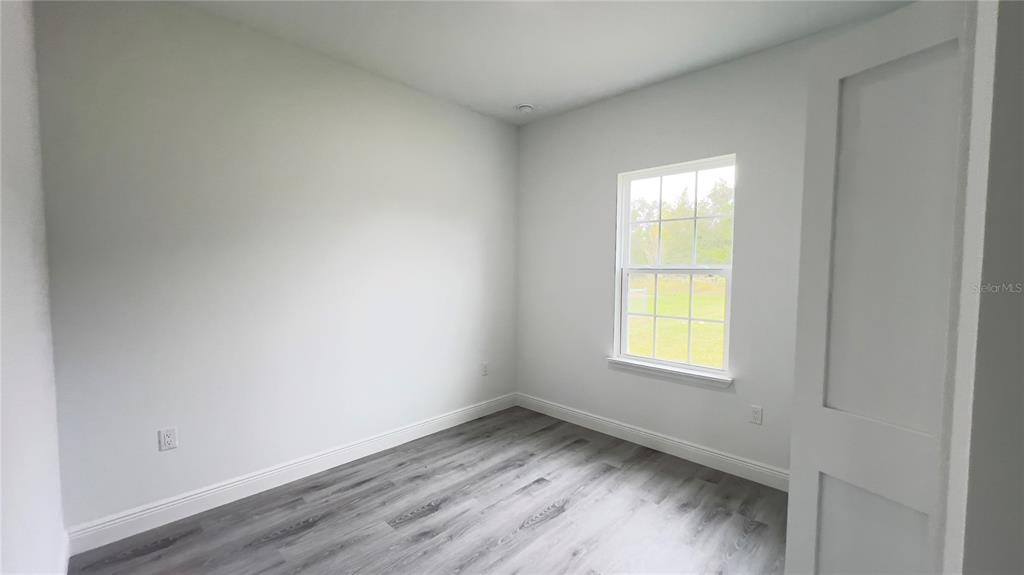 16734 Southwest 18th Avenue Road Ocala, FL 34473 - Photo 24 of 36 an empty room with a window