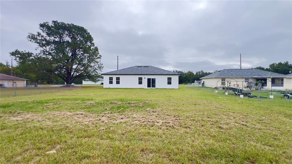 16734 Southwest 18th Avenue Road Ocala, FL 34473 - Photo 36 of 36 a front view of a house with garden