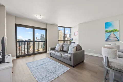 a living room with furniture and a rug