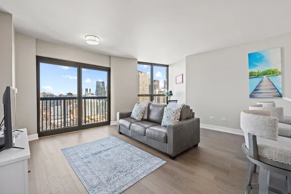 a living room with furniture and a rug
