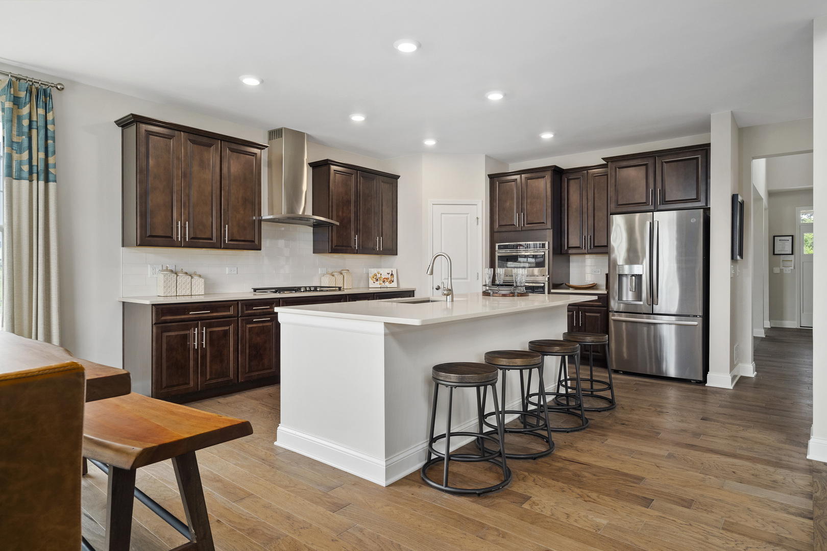 3662 Edelweiss Road Elgin, IL 60124 - Photo 11 of 38 a kitchen with stainless steel appliances a refrigerator stove microwave and cabinets