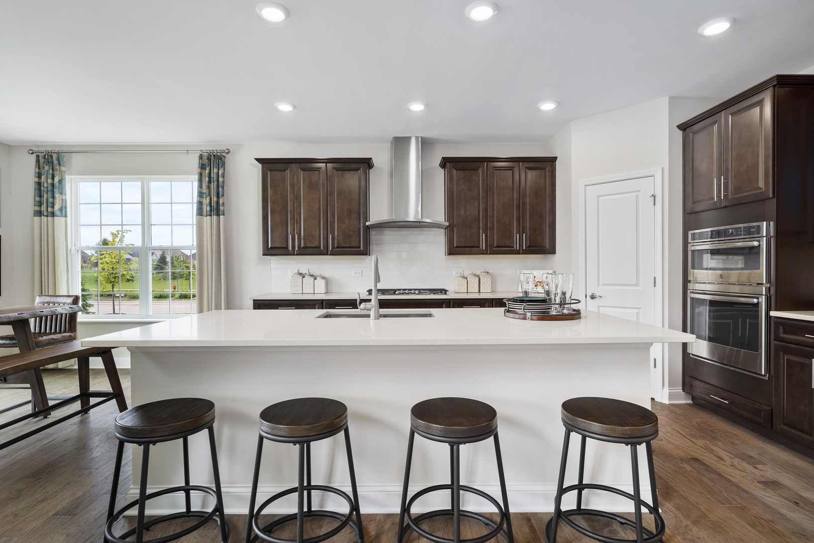 3662 Edelweiss Road Elgin, IL 60124 - Photo 5 of 38 a kitchen with stainless steel appliances a sink and cabinets