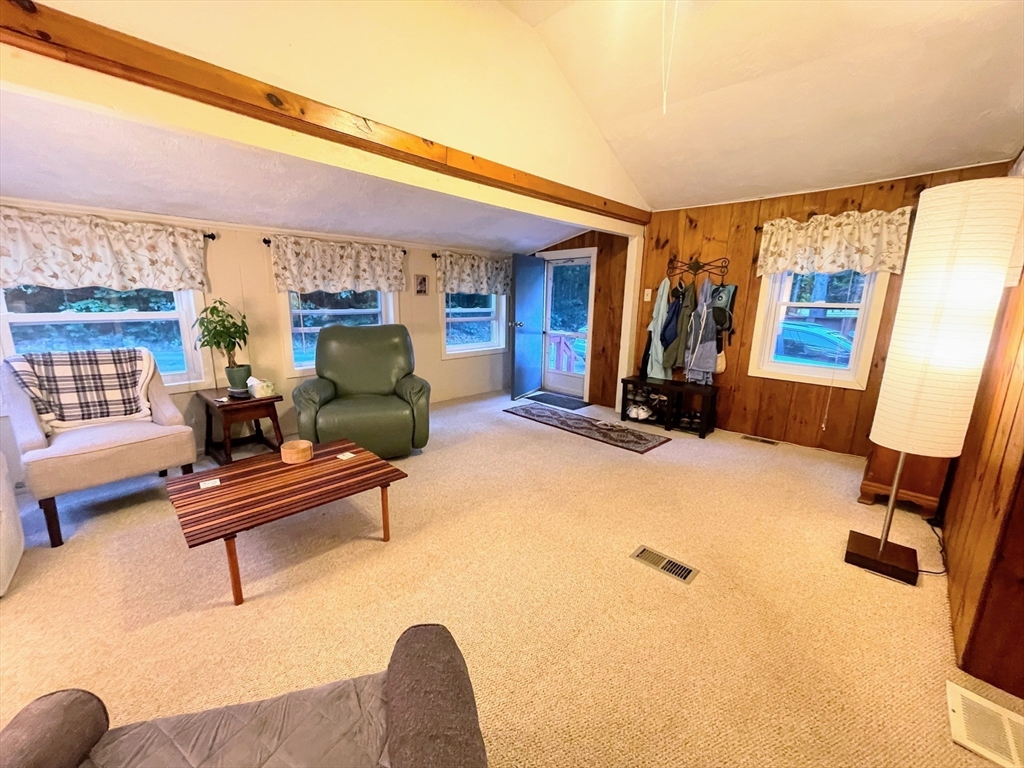 36 Old Battery Road Townsend, MA 01474 - Photo 14 of 33 a living room with furniture gym equipment and a fireplace