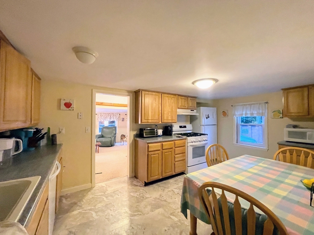 36 Old Battery Road Townsend, MA 01474 - Photo 16 of 33 a large kitchen with a table and chairs in it