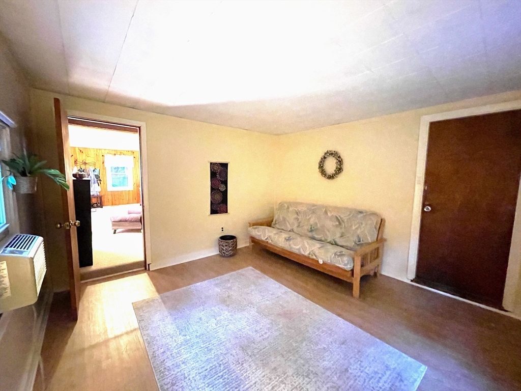 36 Old Battery Road Townsend, MA 01474 - Photo 21 of 33 a bedroom with a bed and wooden floor