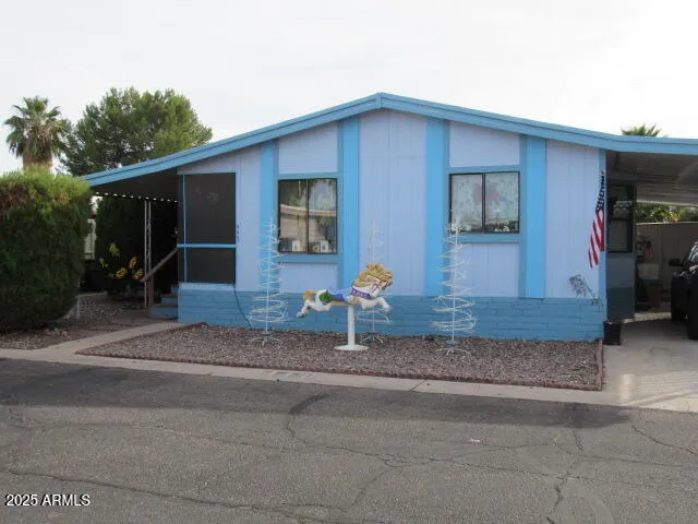 a house that has a tree in front of it