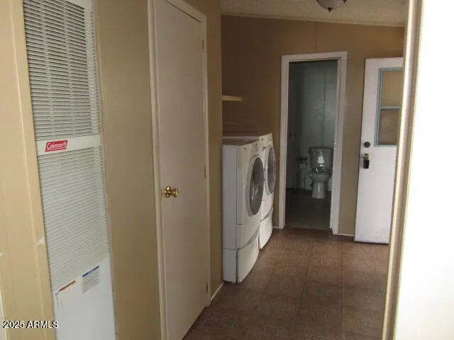 a view of a hallway with washer and dryer