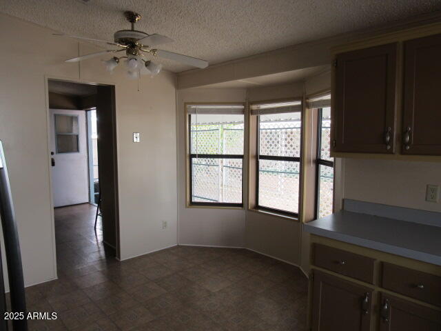3411 South Camino Seco, Unit 443 Tucson, AZ 85730 - Photo 8 of 20 wooden floor in an empty room with a window