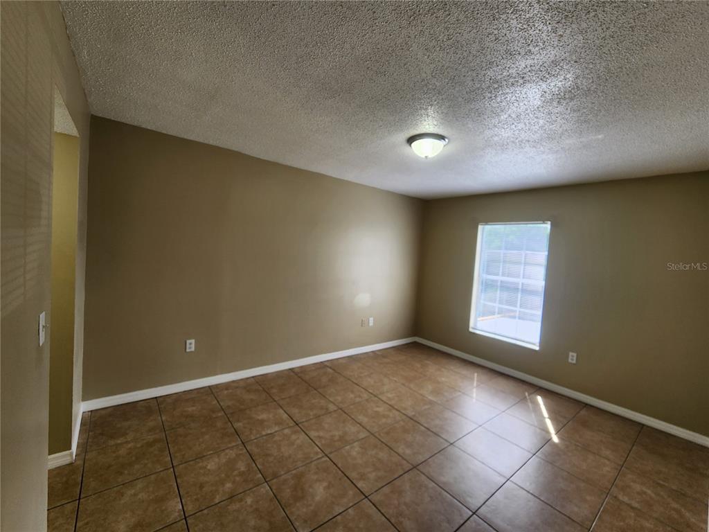 5228 Curry Ford Road, Unit 320 Orlando, FL 32812 - Photo 12 of 19 a view of an empty room with a window