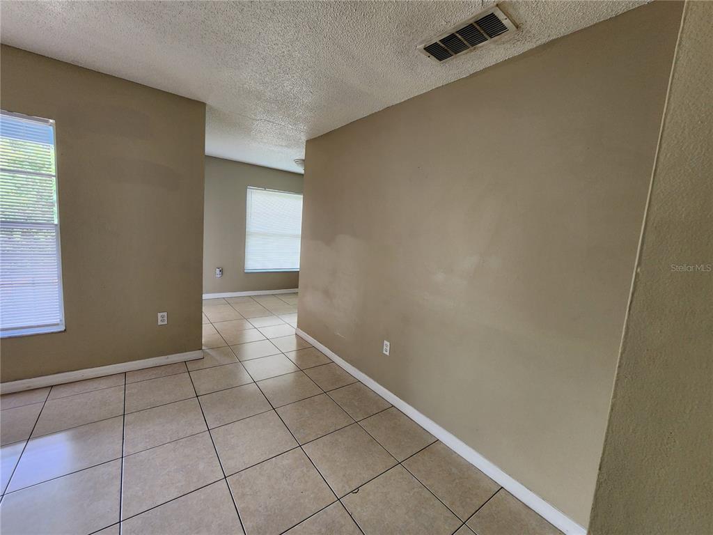5228 Curry Ford Road, Unit 320 Orlando, FL 32812 - Photo 10 of 19 a view of an empty room with window