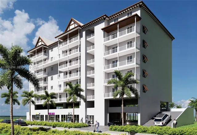 a front view of a building with garden