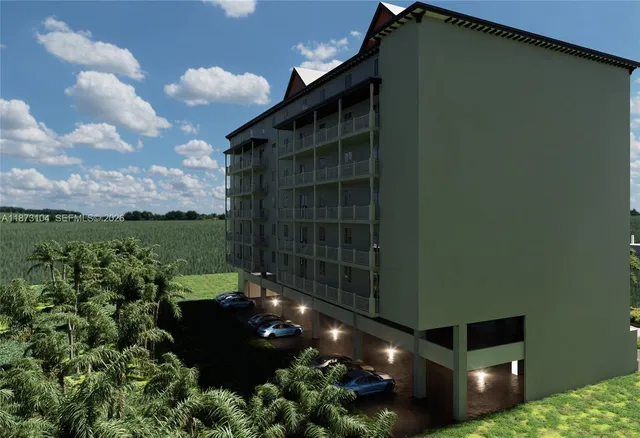 a kitchen with stainless steel appliances a sink a table and chairs