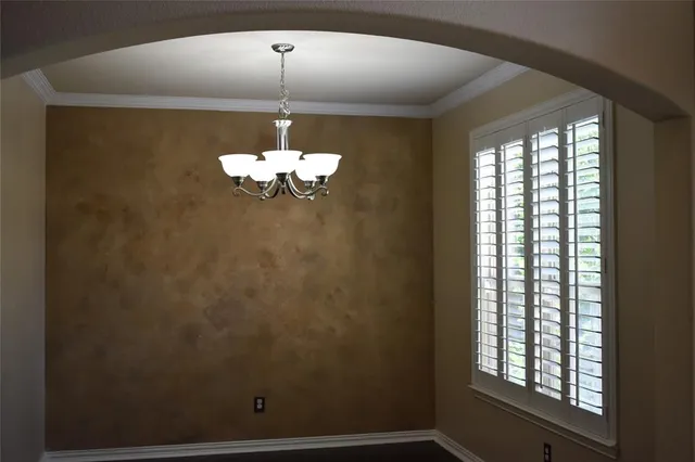 a bathroom with a window and a shower