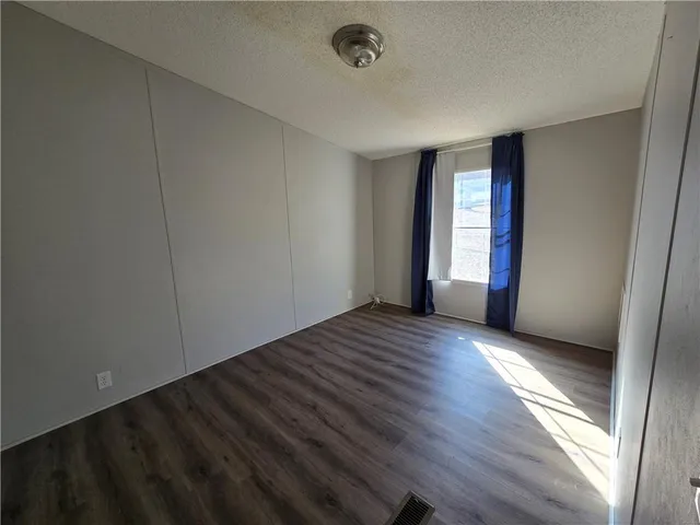 a kitchen with stainless steel appliances granite countertop a sink and a stove