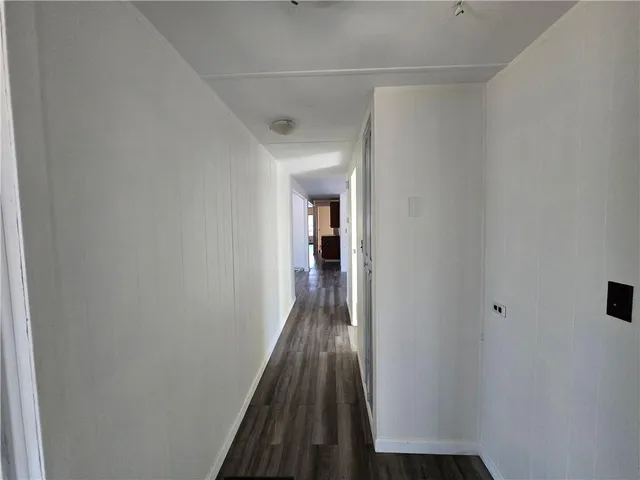 a kitchen with sink stove and microwave