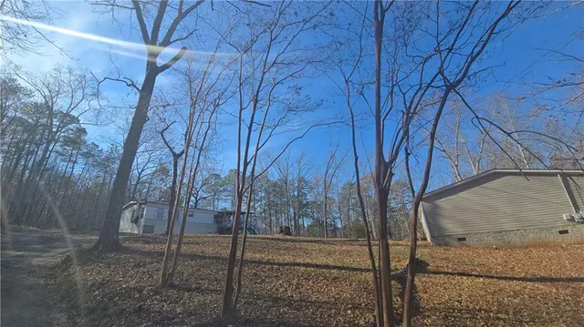 a view of a backyard of the house