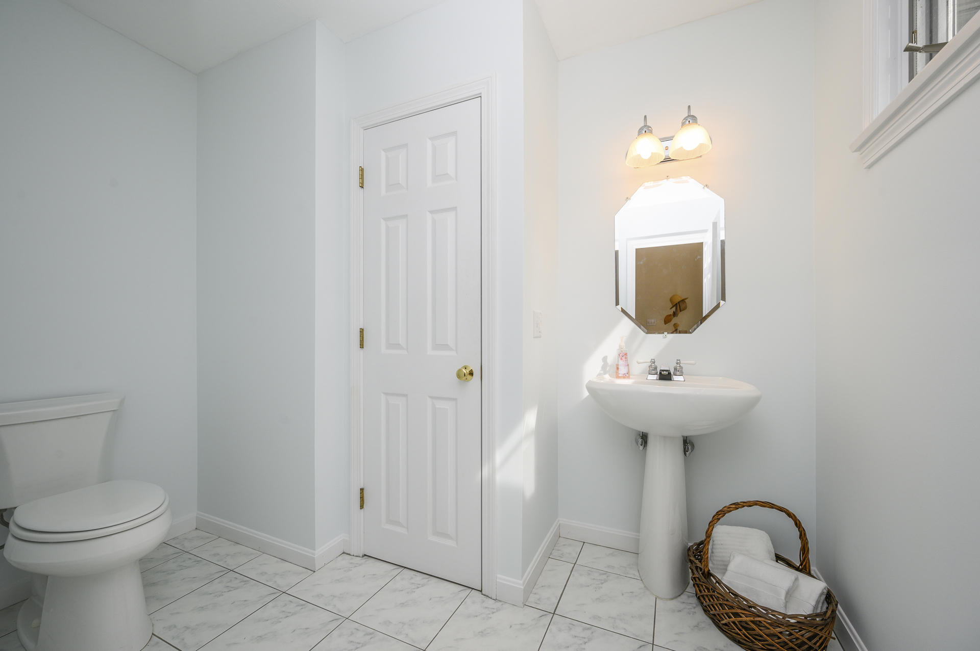 12 Pleasure Point Road Sagamore, MA 02561 - Photo 11 of 29 a bathroom with a toilet sink and mirror