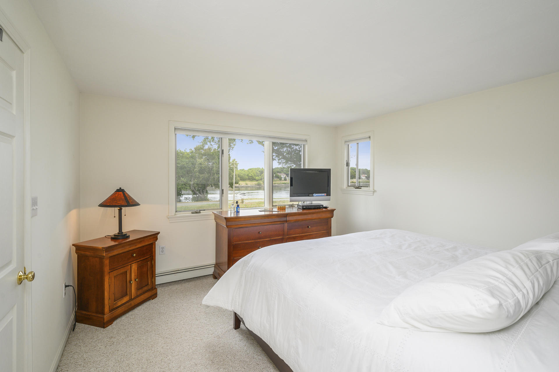 12 Pleasure Point Road Sagamore, MA 02561 - Photo 15 of 29 a bedroom with a bed and a television
