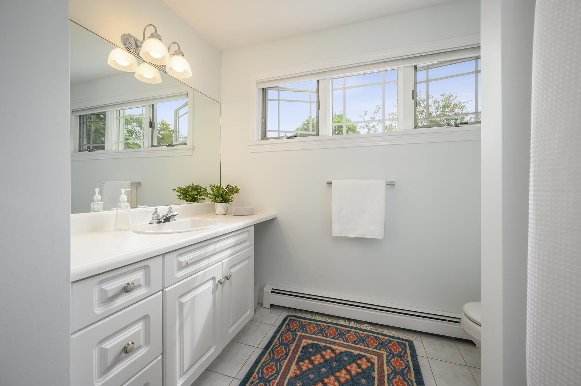 12 Pleasure Point Road Sagamore, MA 02561 - Photo 17 of 29 a bathroom with a sink a mirror and a vanity