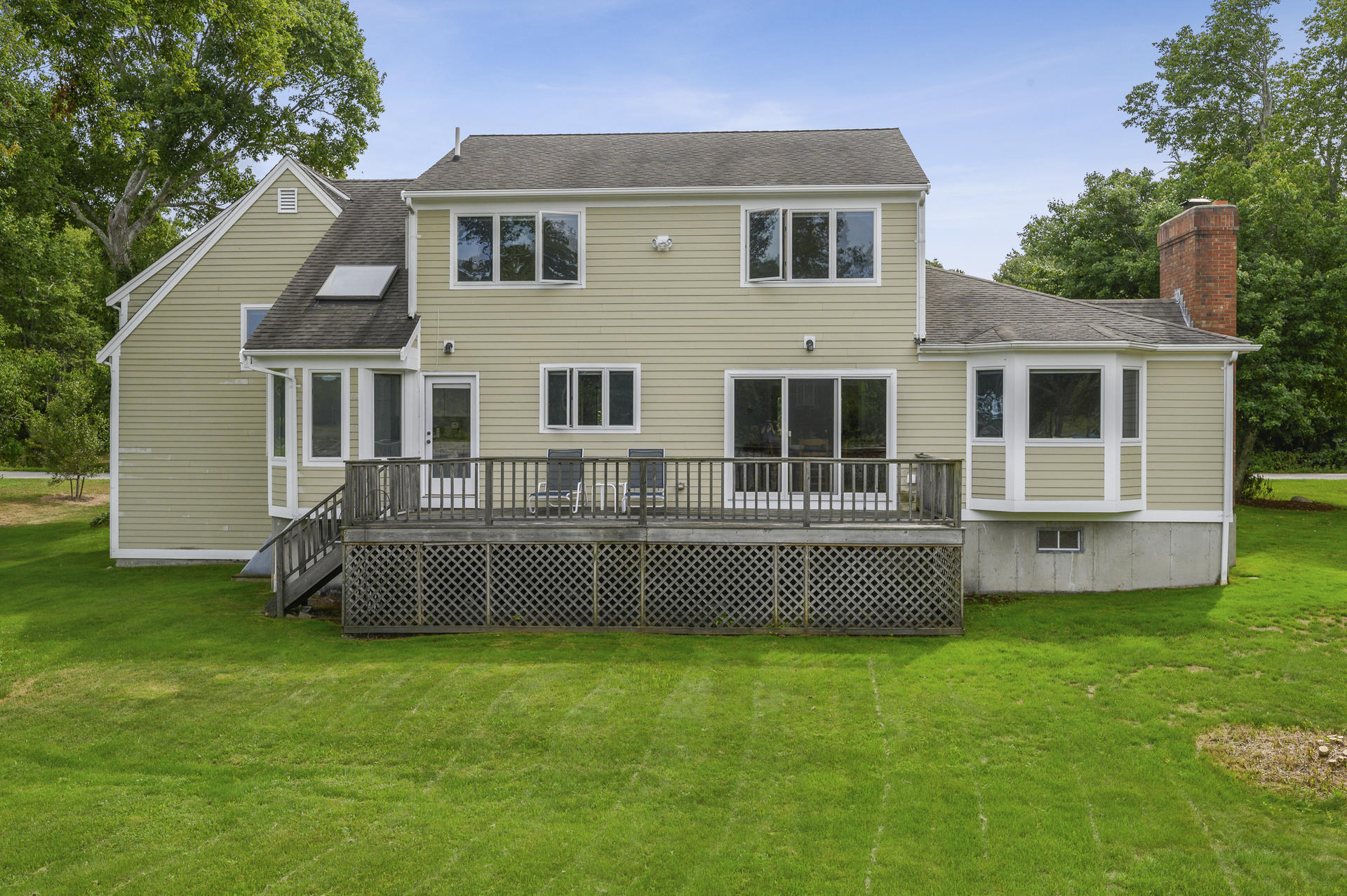 12 Pleasure Point Road Sagamore, MA 02561 - Photo 18 of 29 a front view of house with yard and seating area
