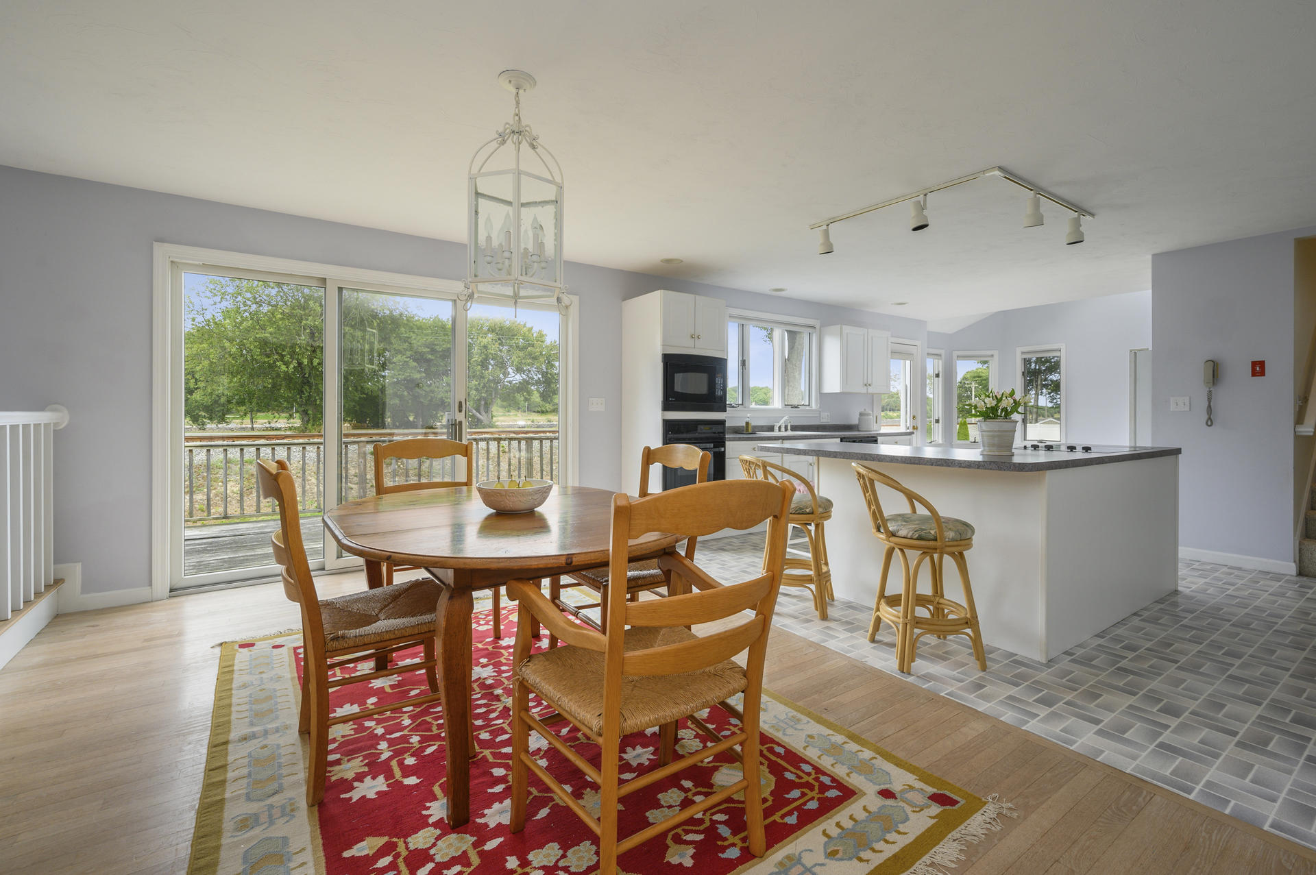 12 Pleasure Point Road Sagamore, MA 02561 - Photo 7 of 29 a dining room with furniture a chandelier and wooden floor