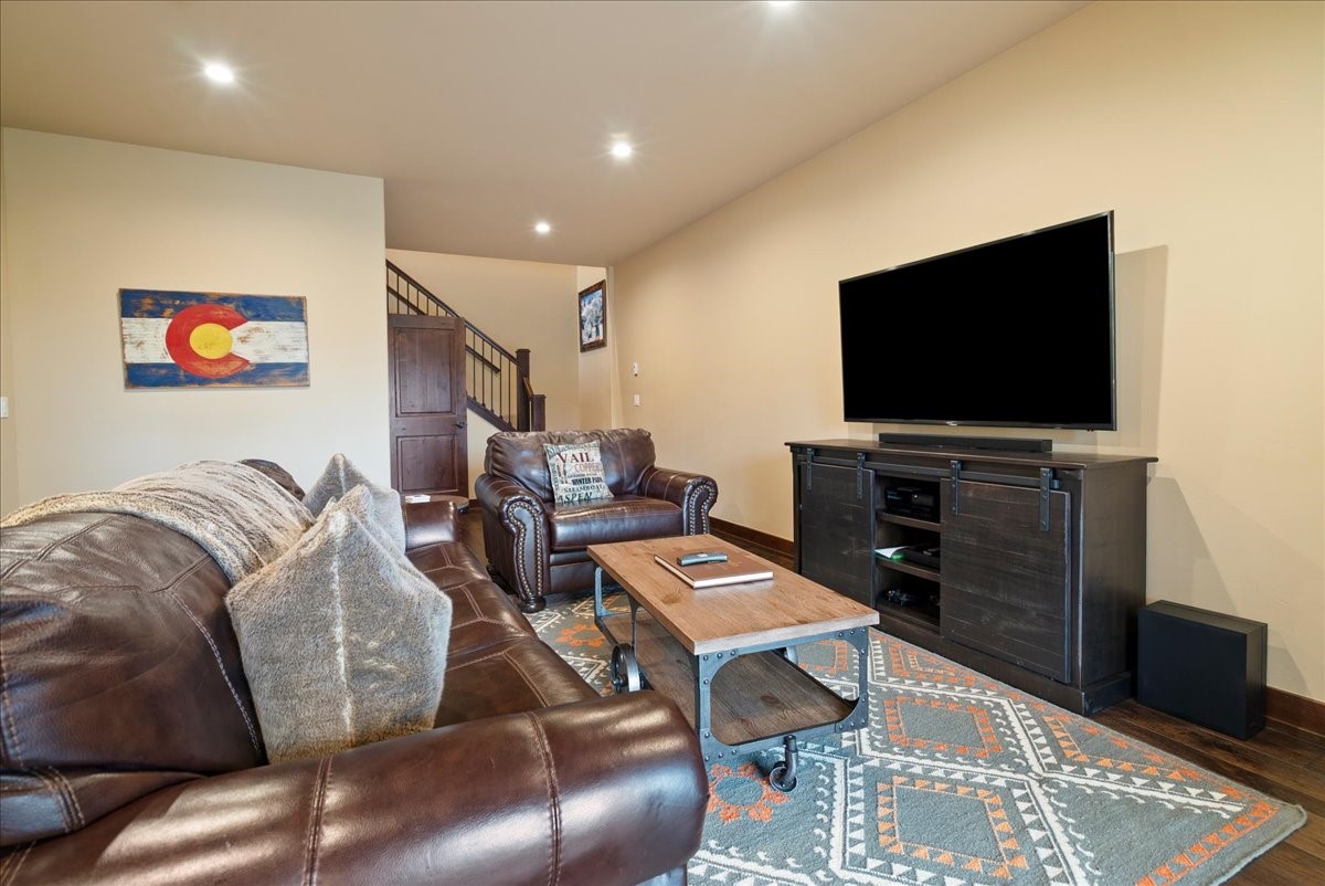 853 Independence Road, Unit 853 Keystone, CO 80435 - Photo 23 of 37 a living room with furniture and a flat screen tv