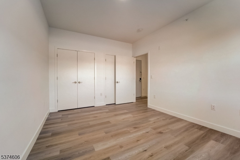 48 Chadwick Street, Unit 203 Paterson, NJ 07503 - Photo 11 of 16 a view of an empty room and wooden floor