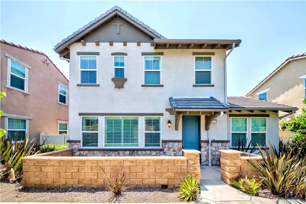 6949 East Riverside Drive Chino, CA 91710 - Photo 1 of 1 a front view of a house with a yard