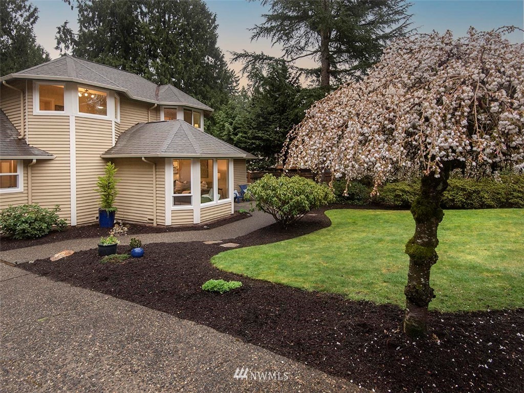 129 200th Place Southeast Bothell, WA 98012 - Photo 2 of 40 a front view of a house with garden