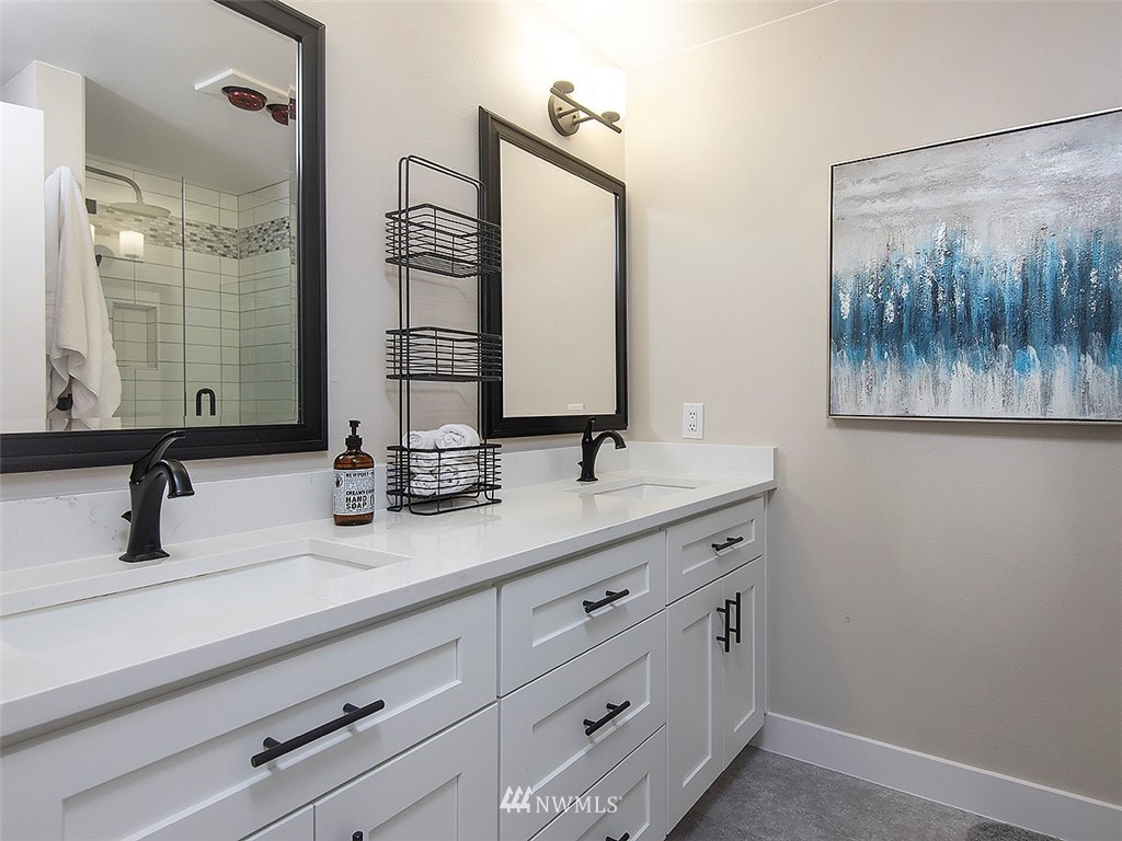 129 200th Place Southeast Bothell, WA 98012 - Photo 28 of 40 a bathroom with a double vanity sink and a mirror