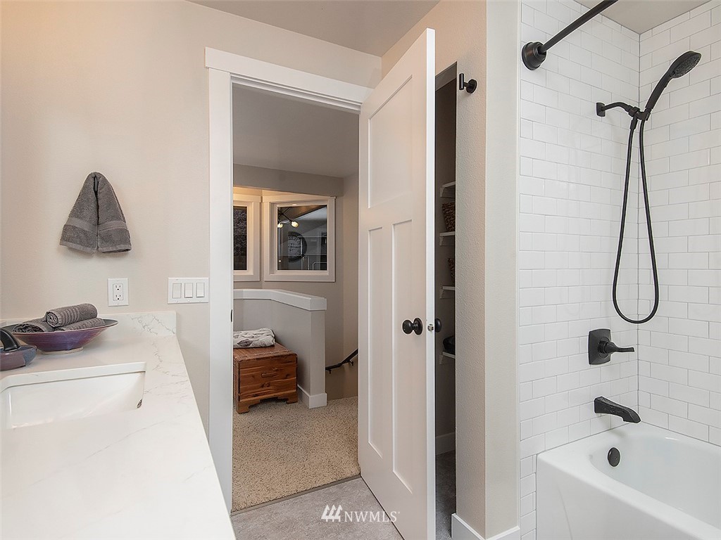 129 200th Place Southeast Bothell, WA 98012 - Photo 33 of 40 a bathroom with a bathtub and a shower