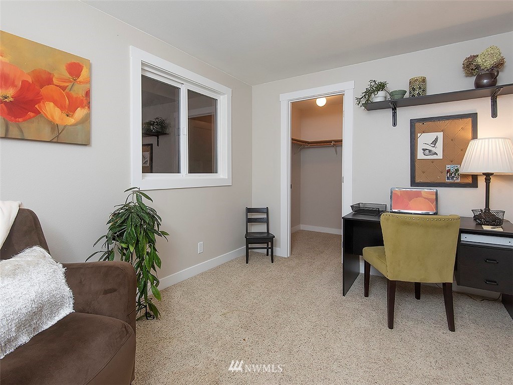 129 200th Place Southeast Bothell, WA 98012 - Photo 35 of 40 a living room with furniture and a lamp