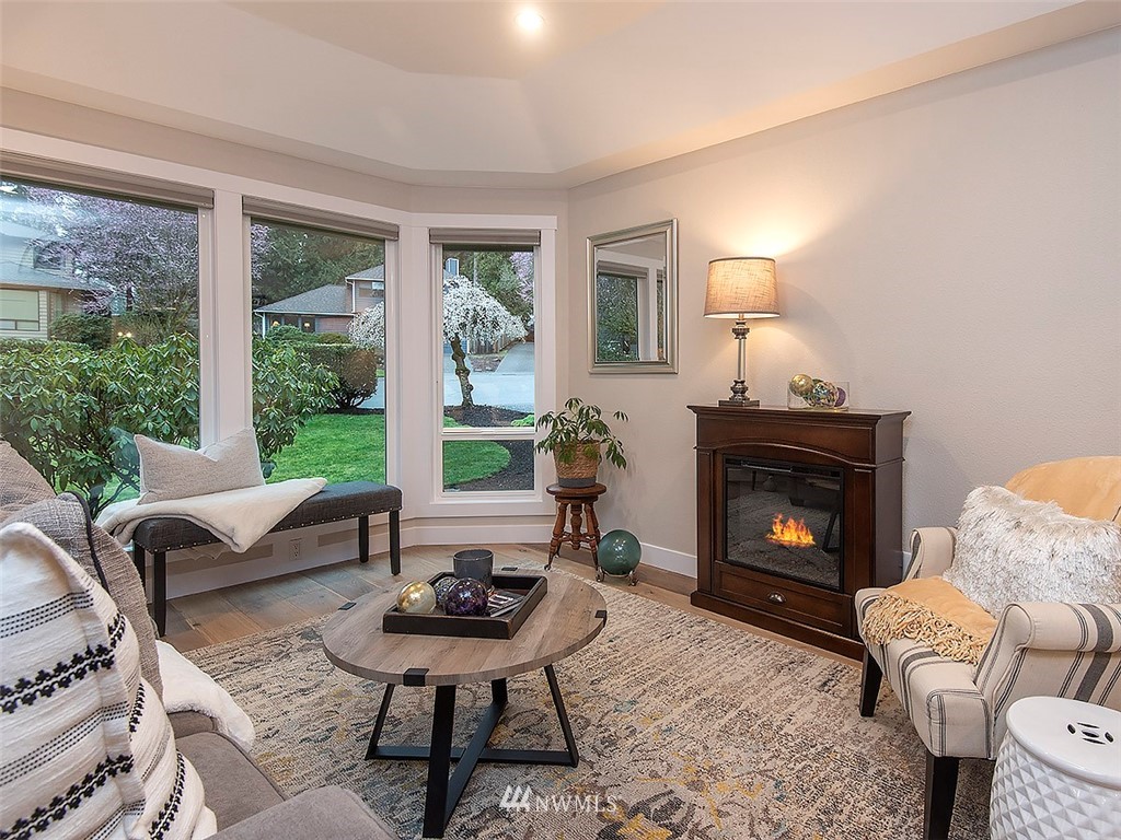 129 200th Place Southeast Bothell, WA 98012 - Photo 6 of 40 a living room with furniture and a fireplace