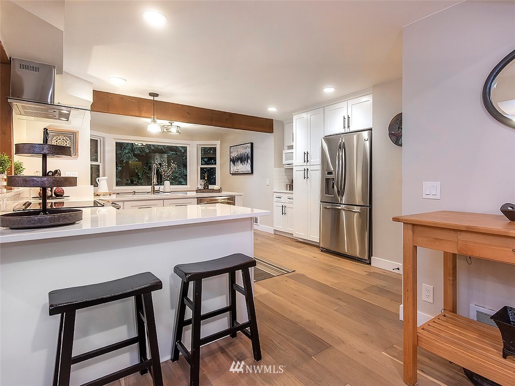 129 200th Place Southeast Bothell, WA 98012 - Photo 9 of 40 a kitchen with stainless steel appliances a refrigerator and a stove