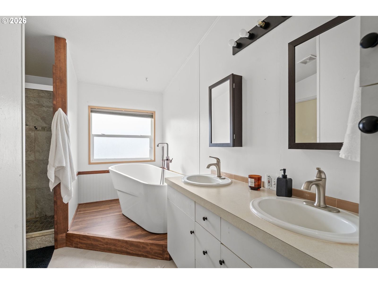 910 East College Echo, OR 97826 - Photo 11 of 23 a bathroom with a double vanity sink mirror and bathtub