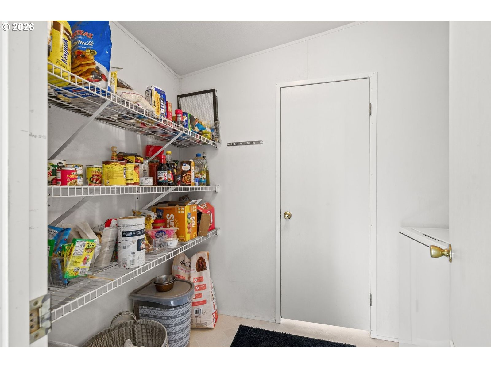 910 East College Echo, OR 97826 - Photo 17 of 23 a utility room with lots of clutter and refrigerator