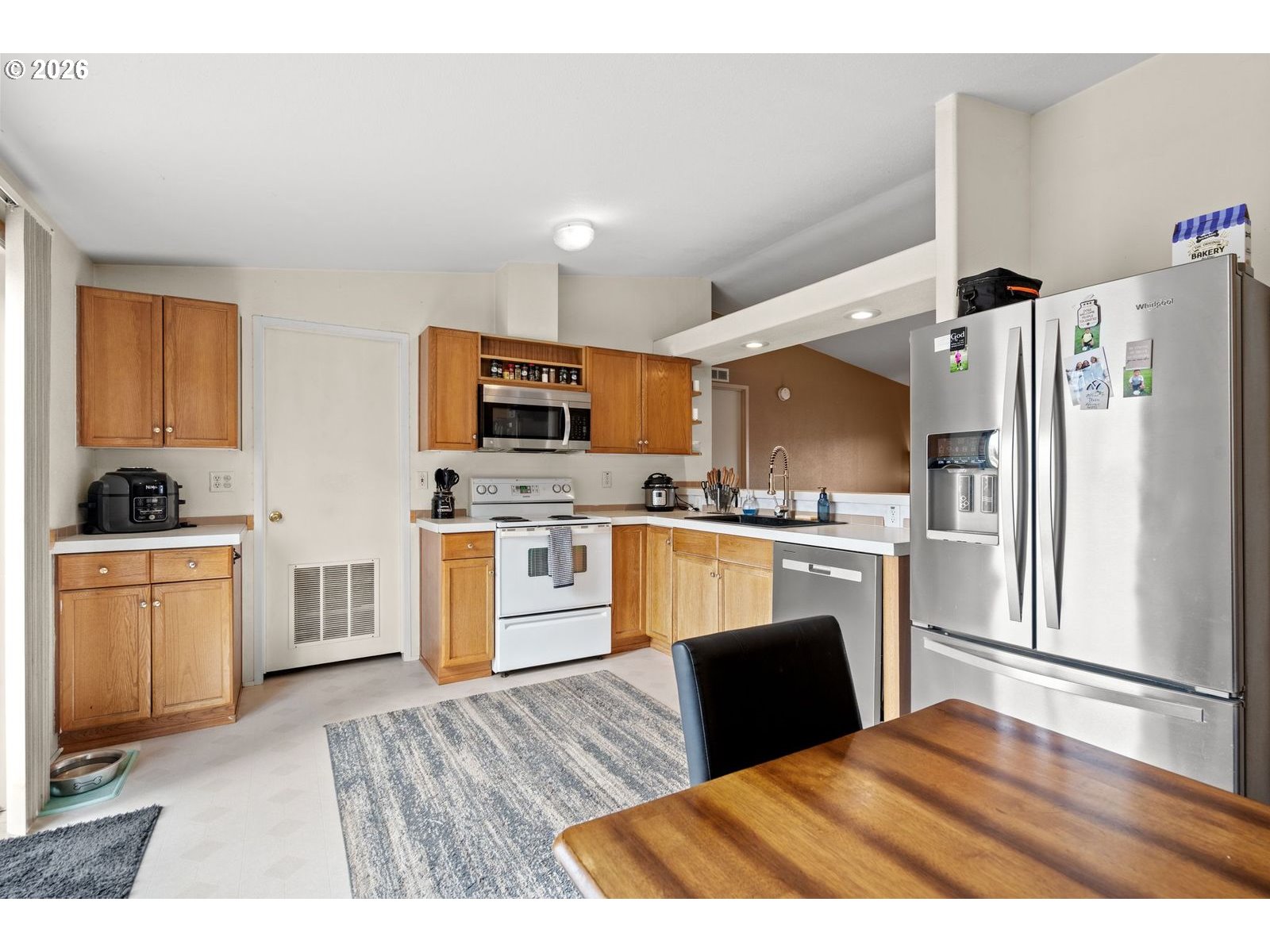 910 East College Echo, OR 97826 - Photo 7 of 23 a kitchen with granite countertop a refrigerator stove top oven and sink