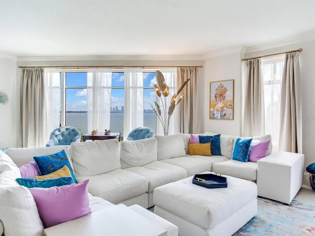 a view of a city from a dining room with large windows